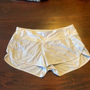 Used white Lululemon workout shorts.  Size 6
